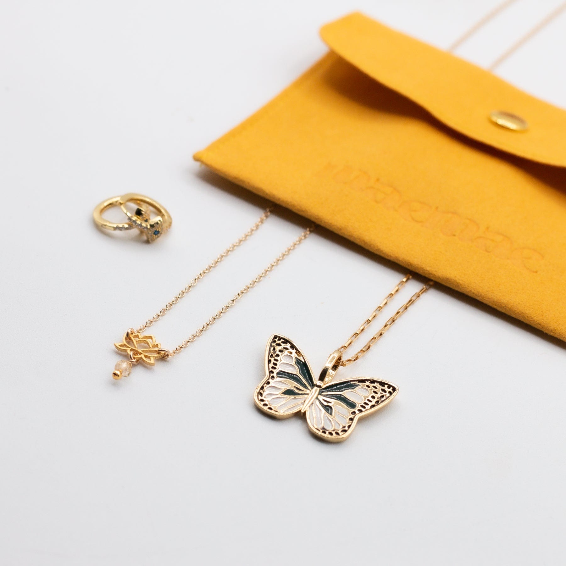 Handmade butterfly charm necklace in a MaeMae travel pouch.- 14k Gold-Filled - MaeMae Jewelry