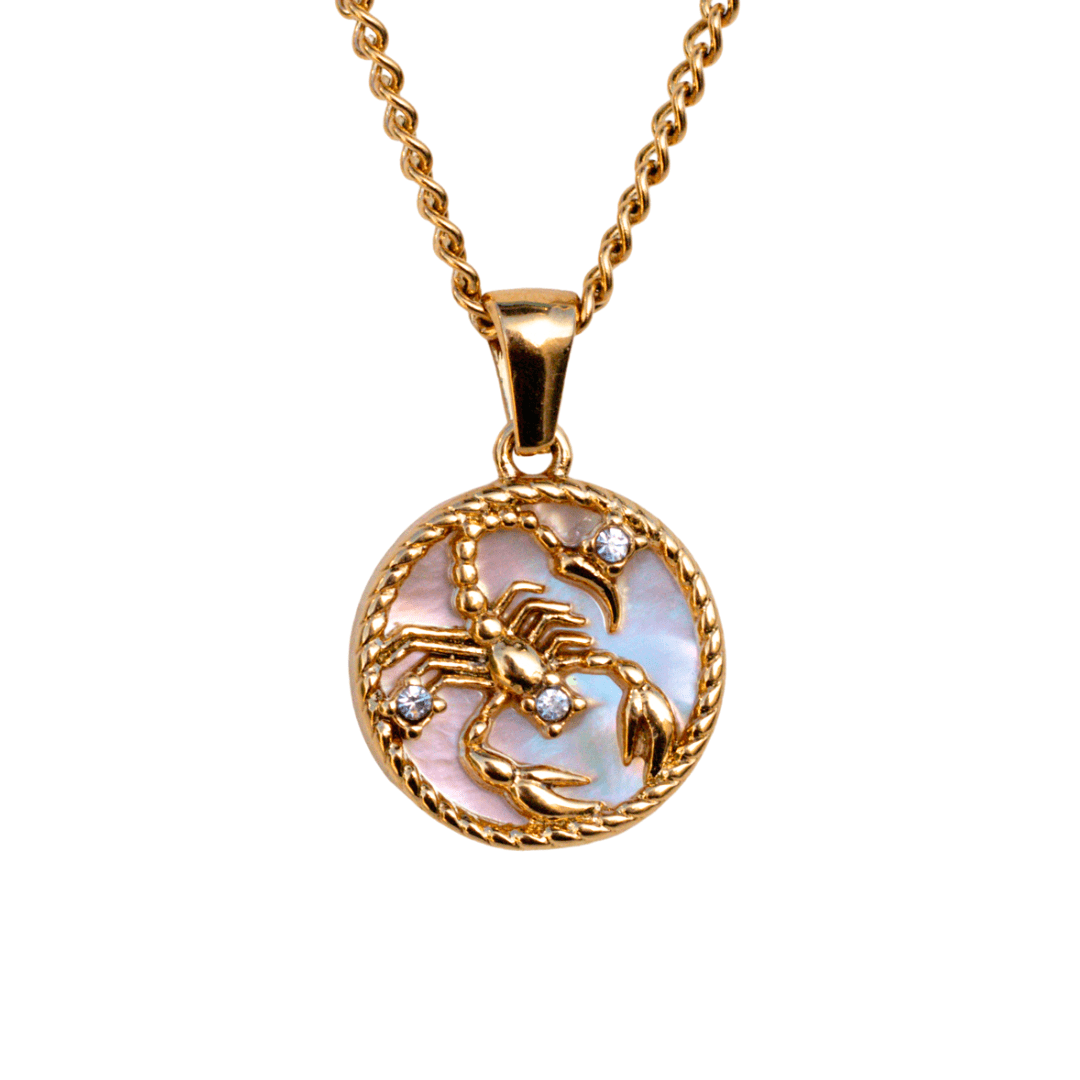 Close-up of a scorpio 18k gold zodiac necklace pendant on a delicate chain, representing a personalized astrological sign - MaeMae Jewelry