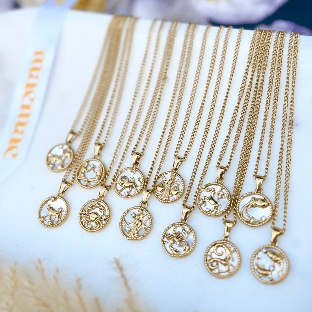 Astrology-inspired gold necklace featuring a zodiac pendant on an 18” stainless steel chain with a 2-inch extender.