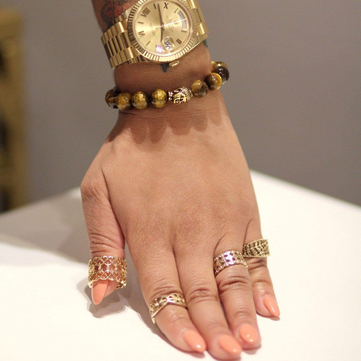 Personalized stone bracelet on a wrist, showcasing unique crystal combinations.