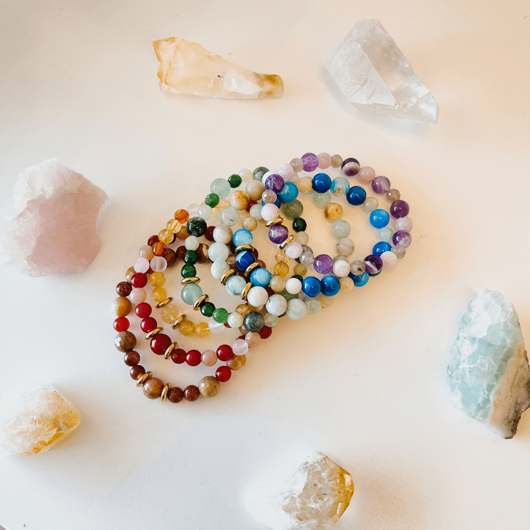 Handmade crystal bracelet on a stretch cord, featuring a mix of vibrant healing stones.