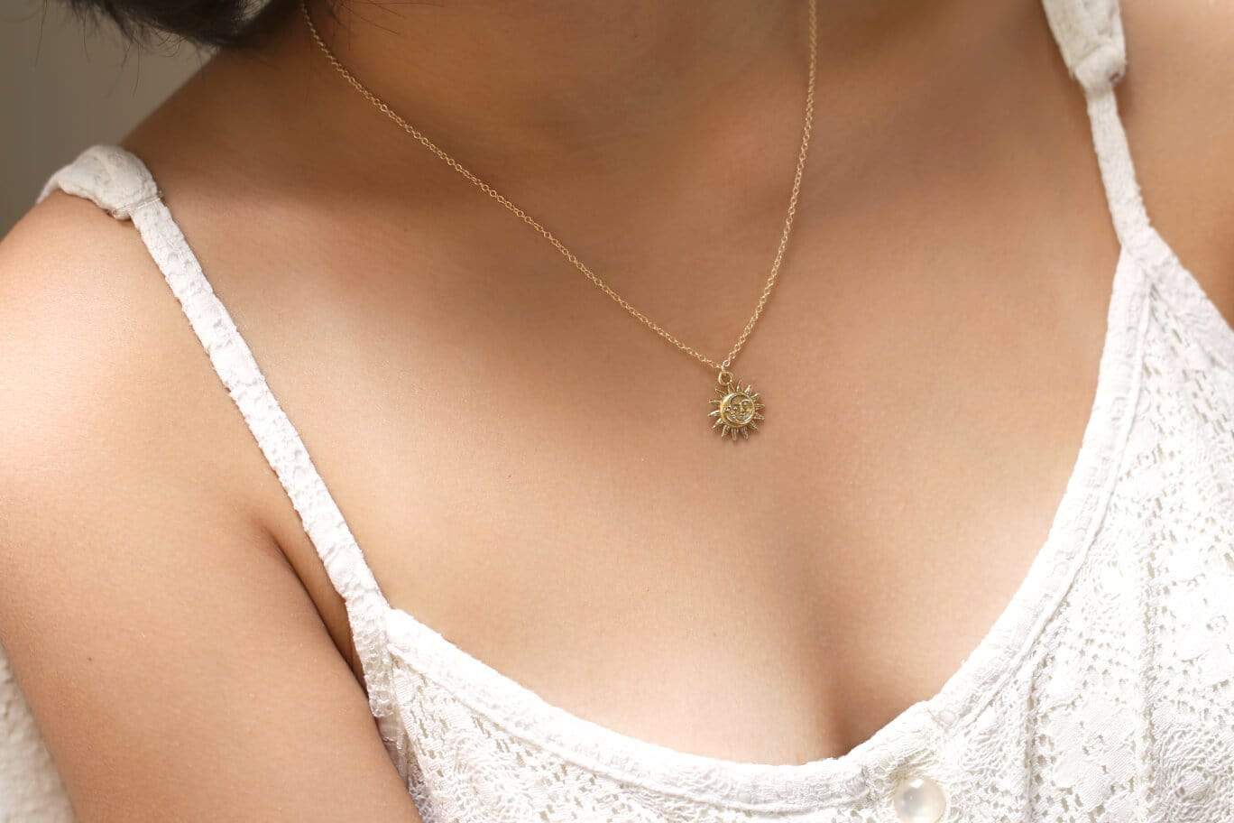 MaeMae Customer wearing a 14k Gold Filled Light After Dark Necklace with a Gold Sun Moon Charm.