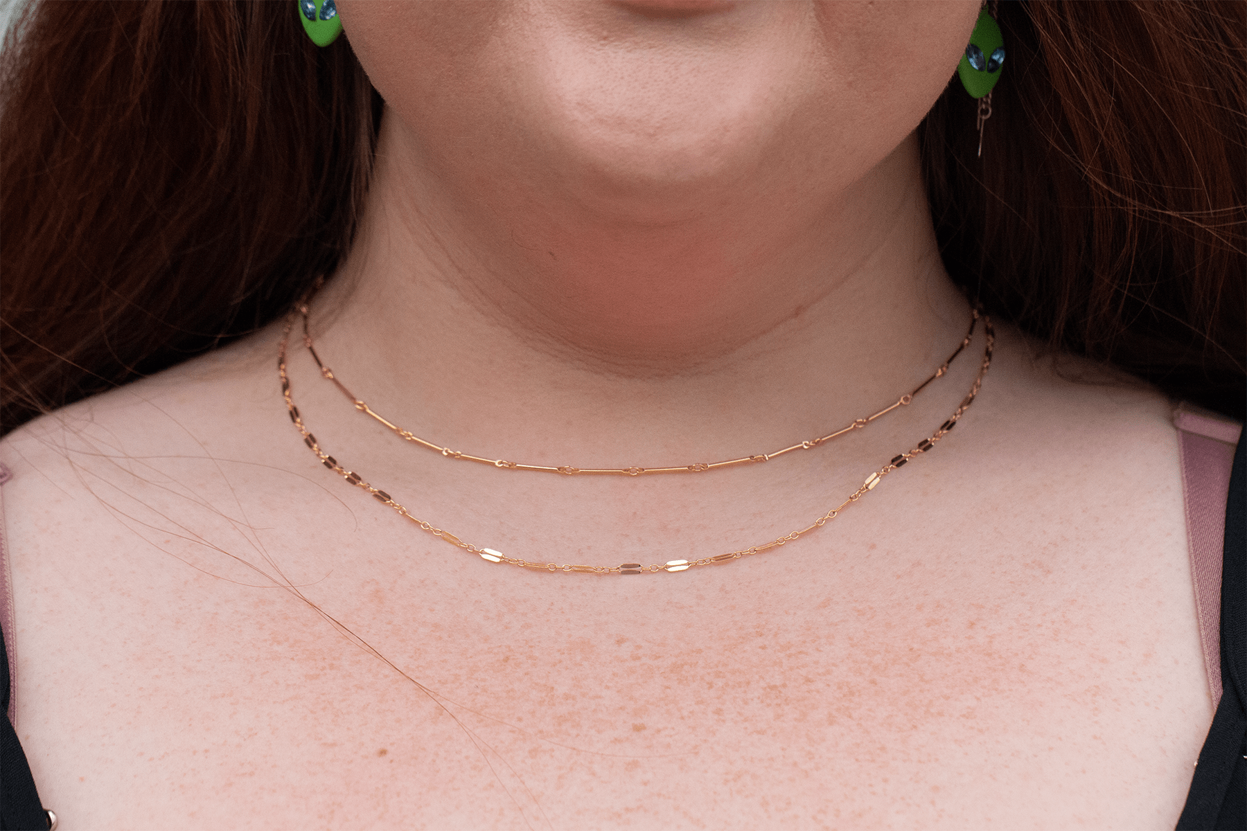 Vulnerability necklace layered with Be Kind necklace