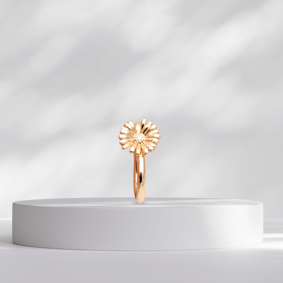 Gold Daisy Flower Clip on a white platform against a light gray background