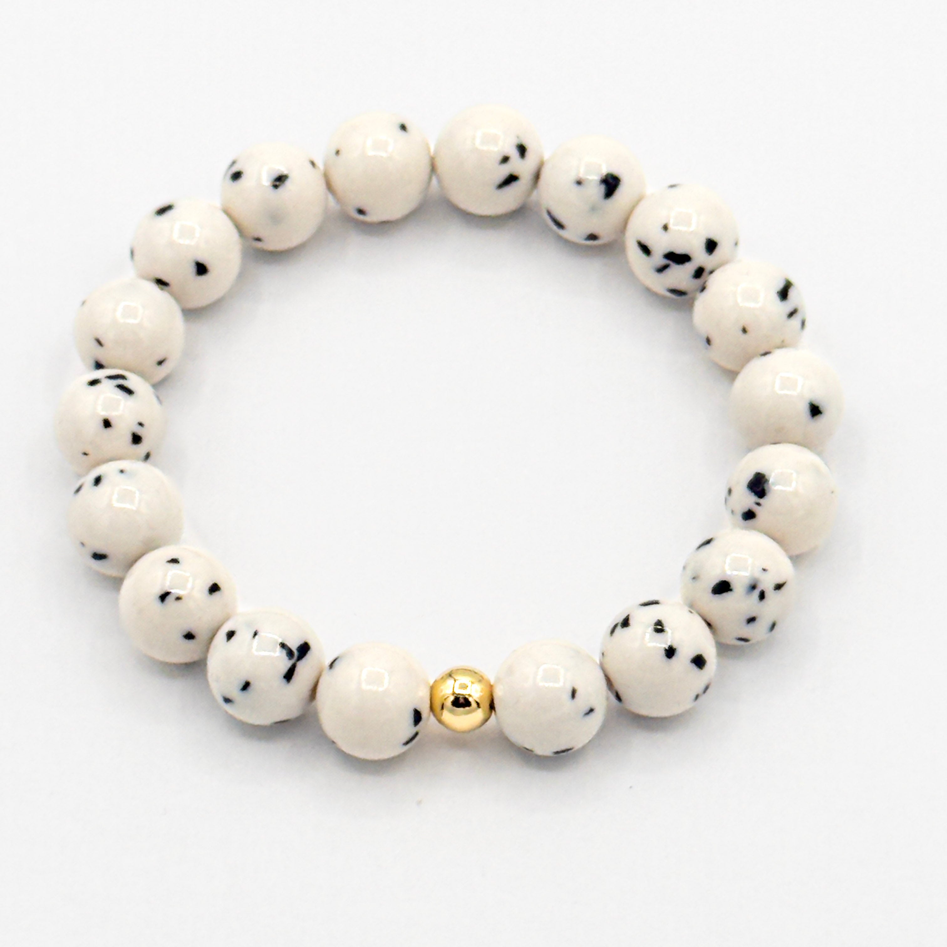 Dalmatian Jade is known for grounding your energy while lifting your mood