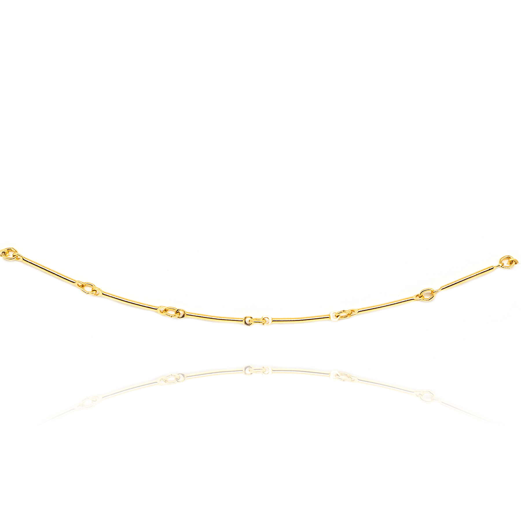 Be Kind minimal gold bracelet on white background