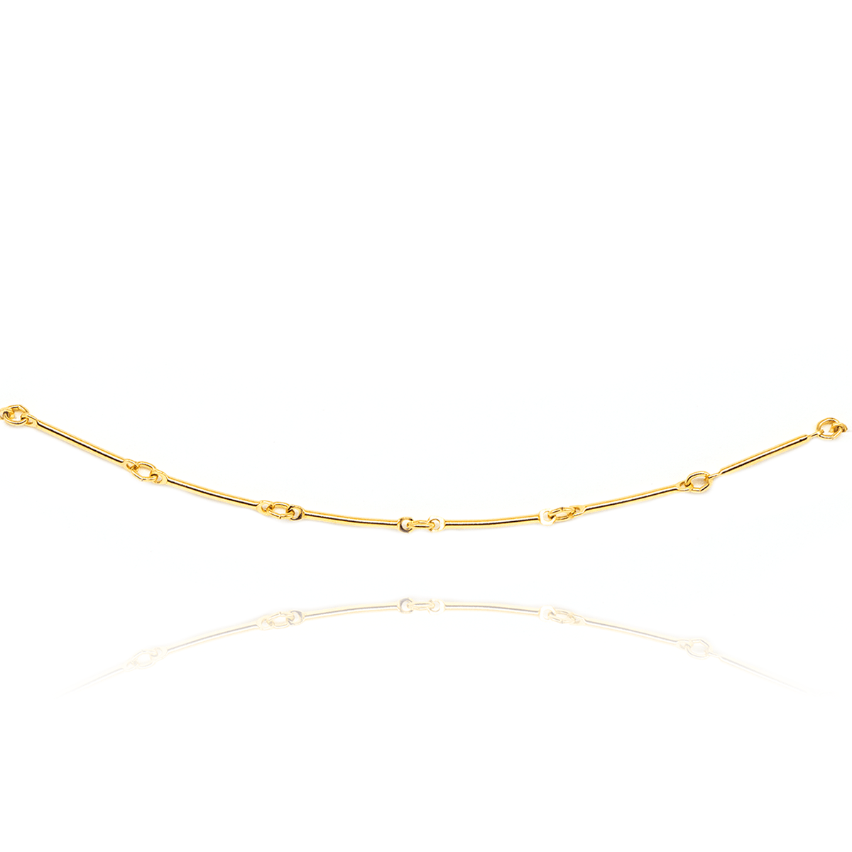 Be Kind minimal gold bracelet on white background