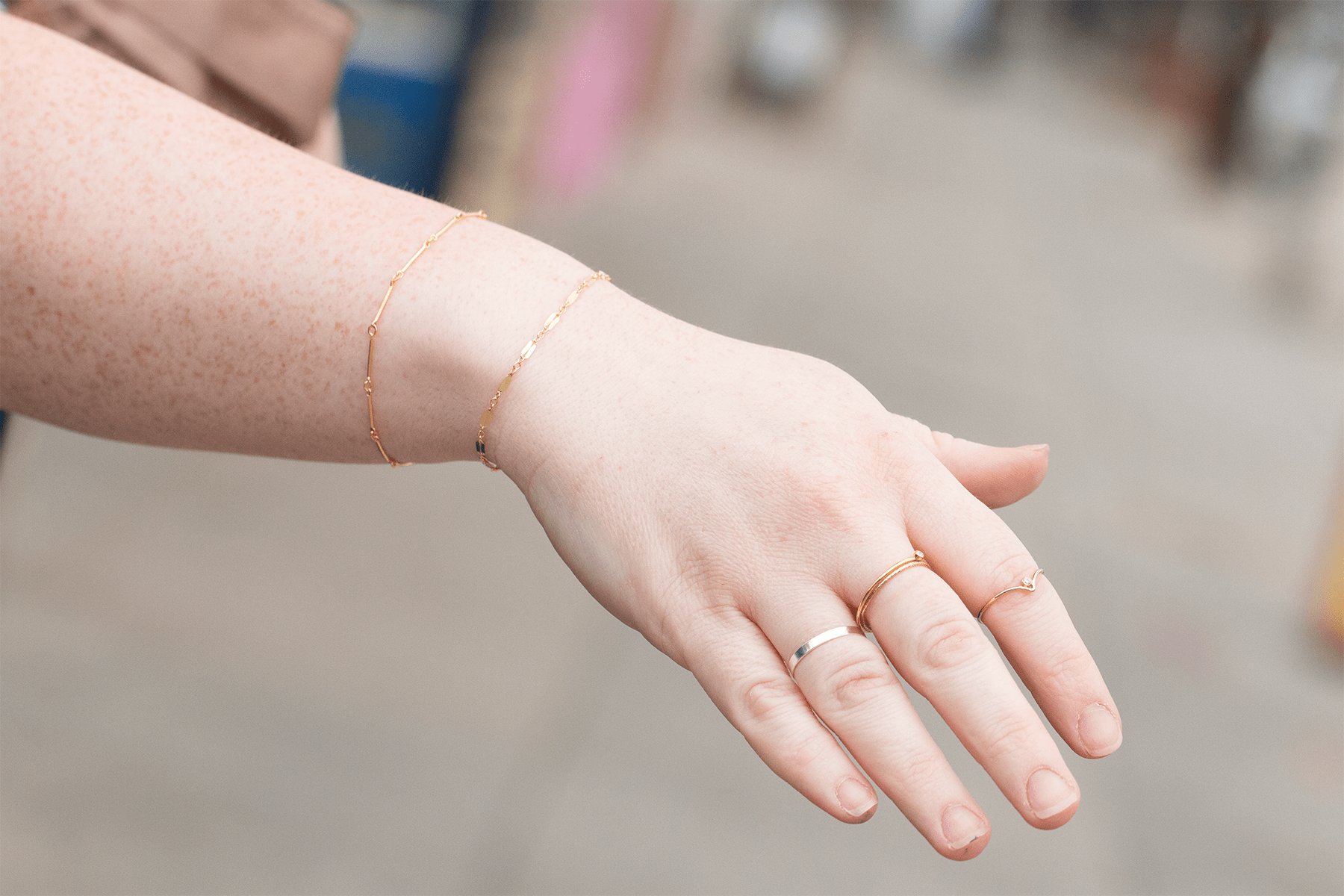 Be Kind bracelet worn with Vulnerability bracelet and rings