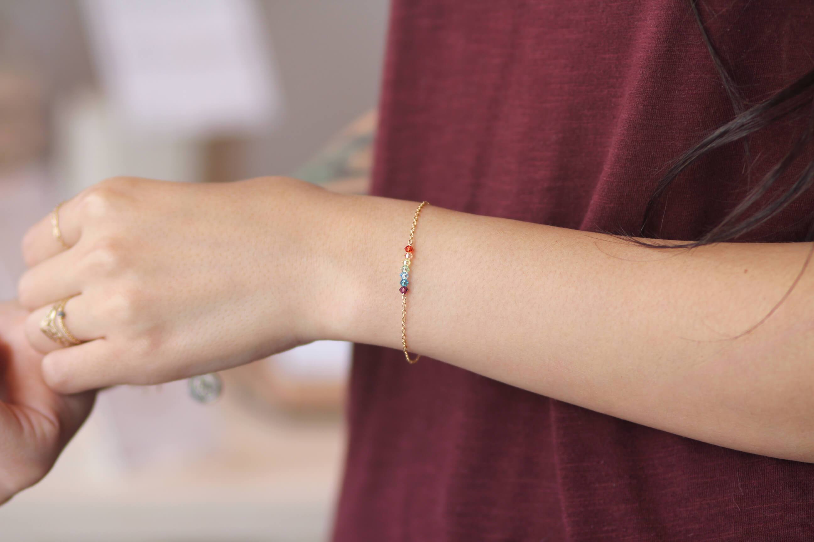 MaeMae customer wearing her new favorite 7 Chakras gold chain bracelet.