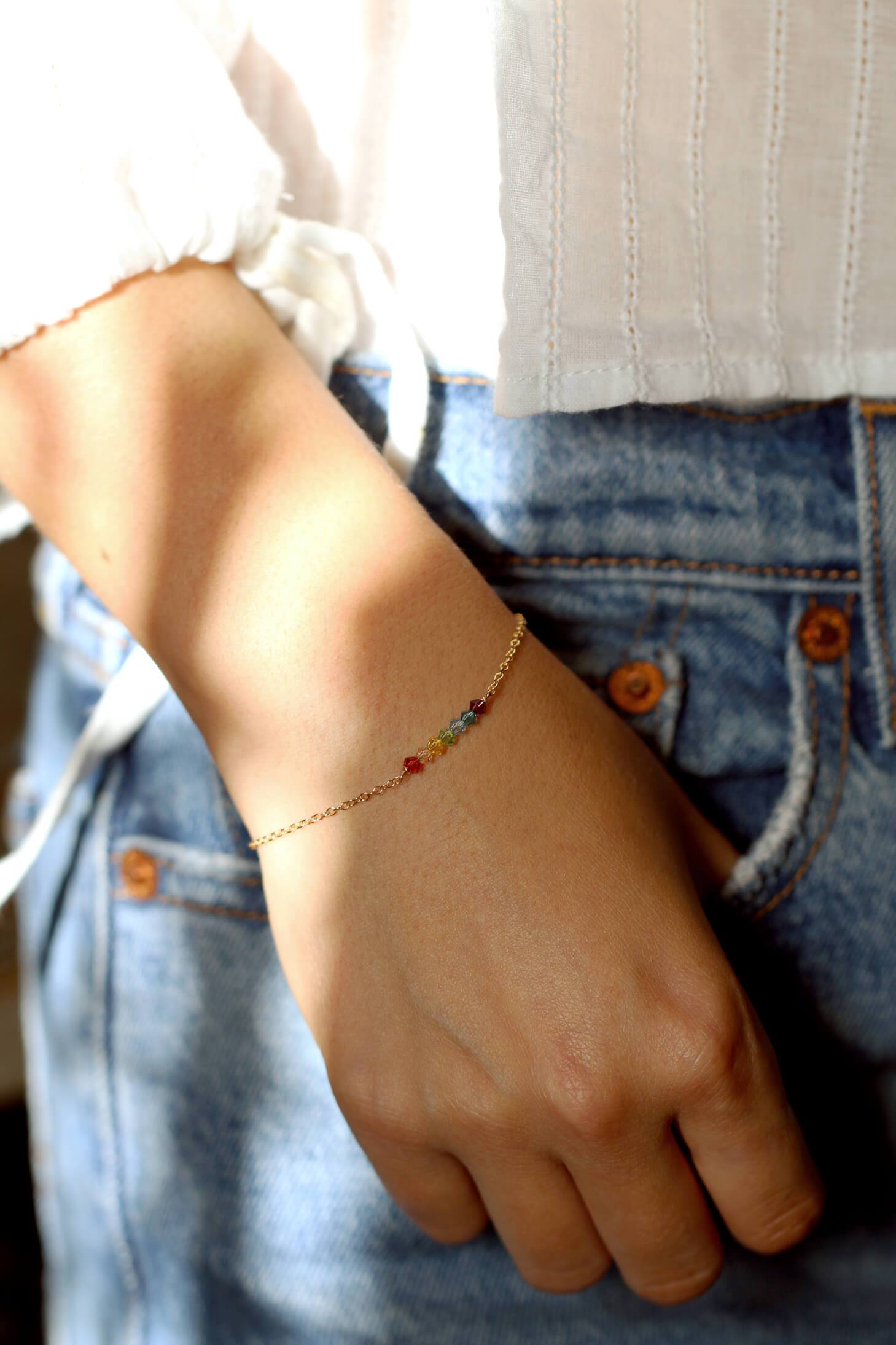 Customer wearing The 7 Chakras bracelet by MaeMae on a 14k Gold Filled Chain.