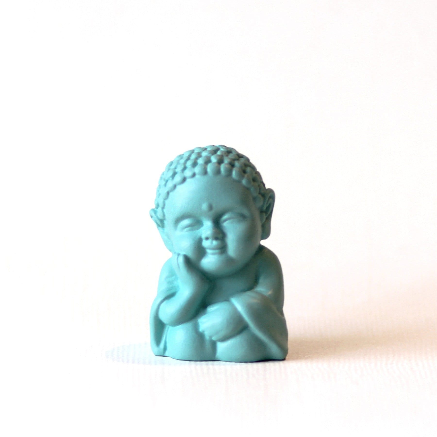 Light teal dream baby buddha statue