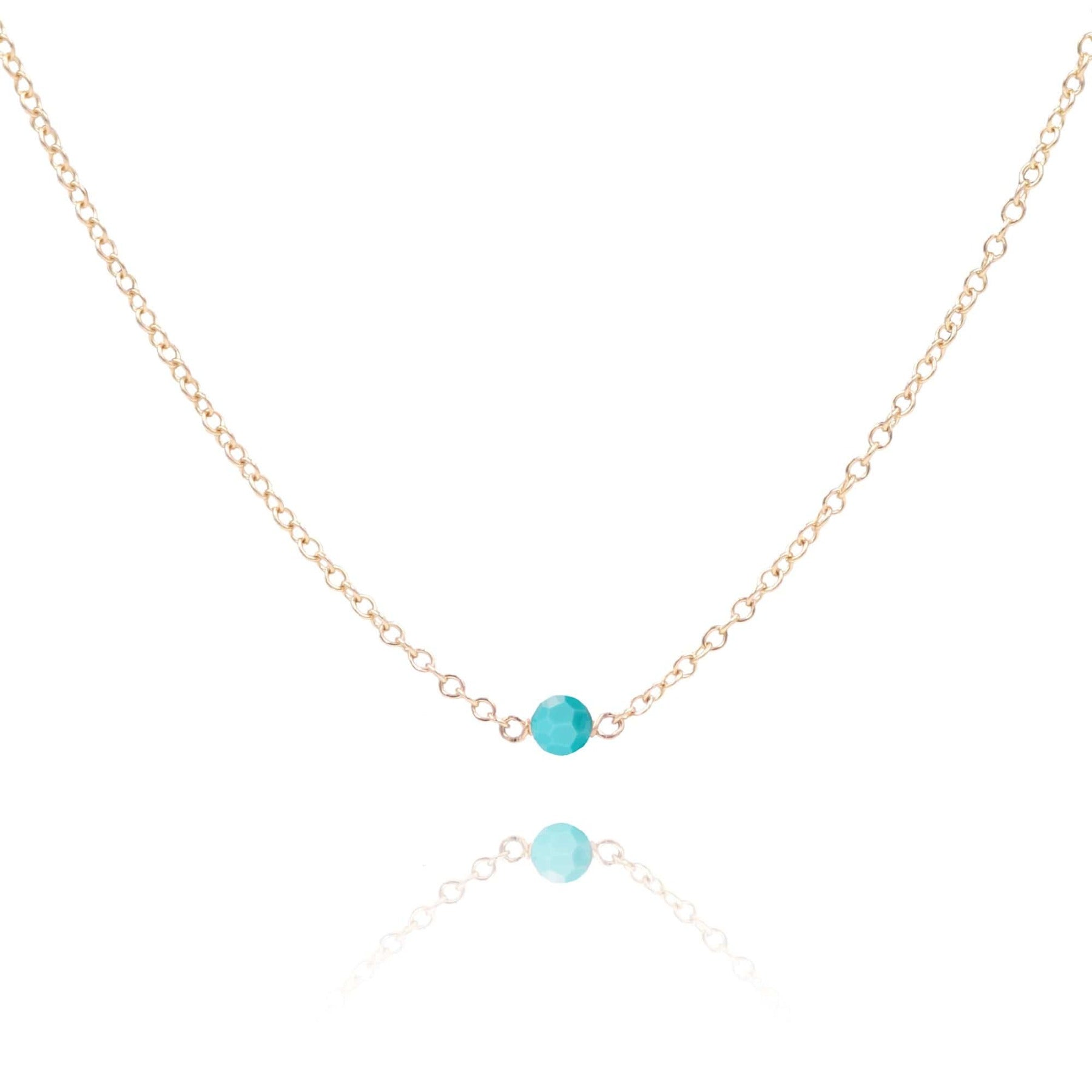 Serenity turquoise stone gold necklace on white background