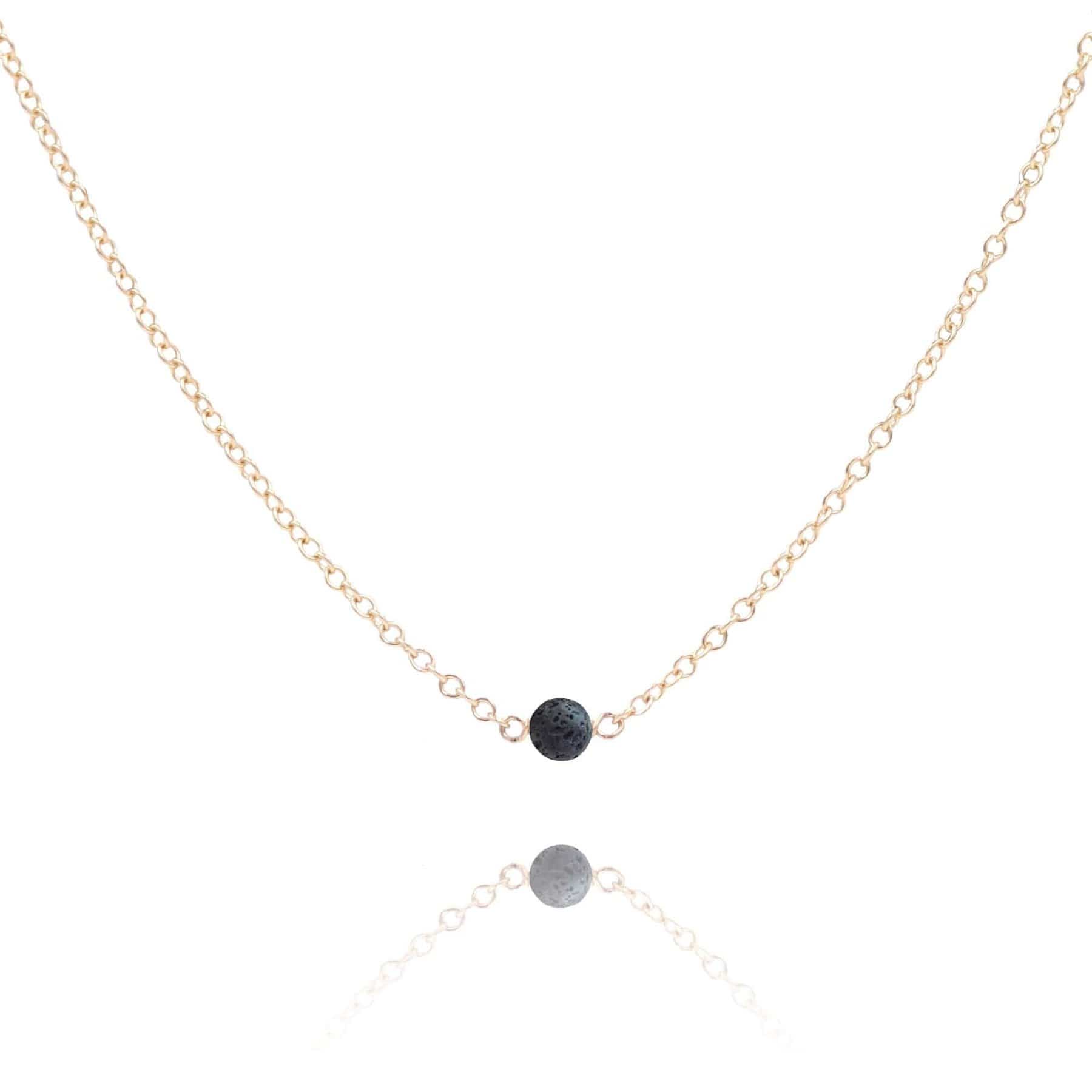 Lava stone gold filled necklace on white background