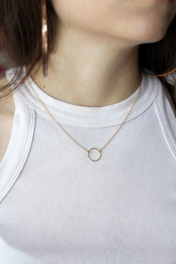 Model wearing MaeMae's Everything Happens For A Reason Necklace in a 14K Gold Fillled Finish.