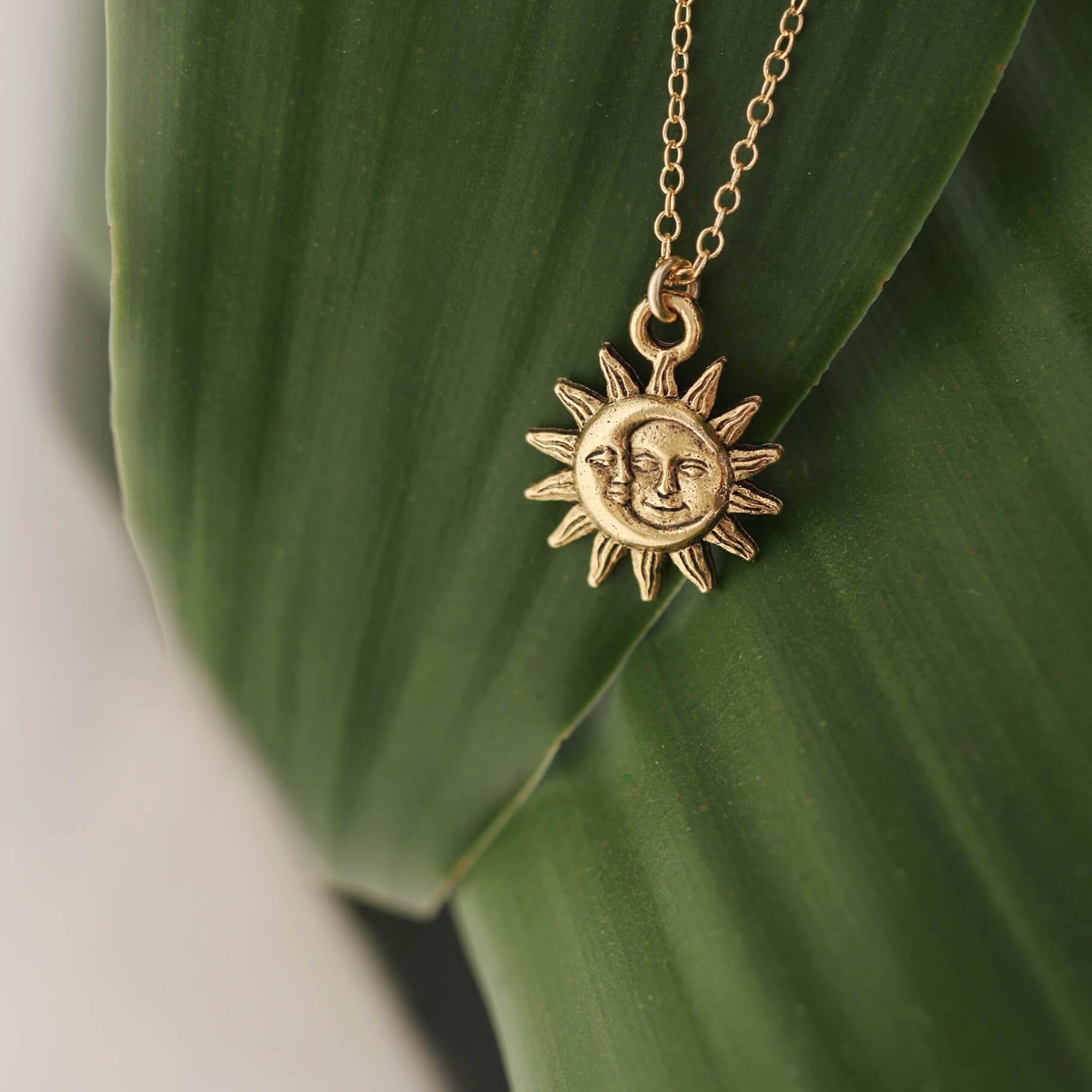 Detailed view of 14k Gold Filled Light After Dark Necklace with Gold Sun Moon Charm.