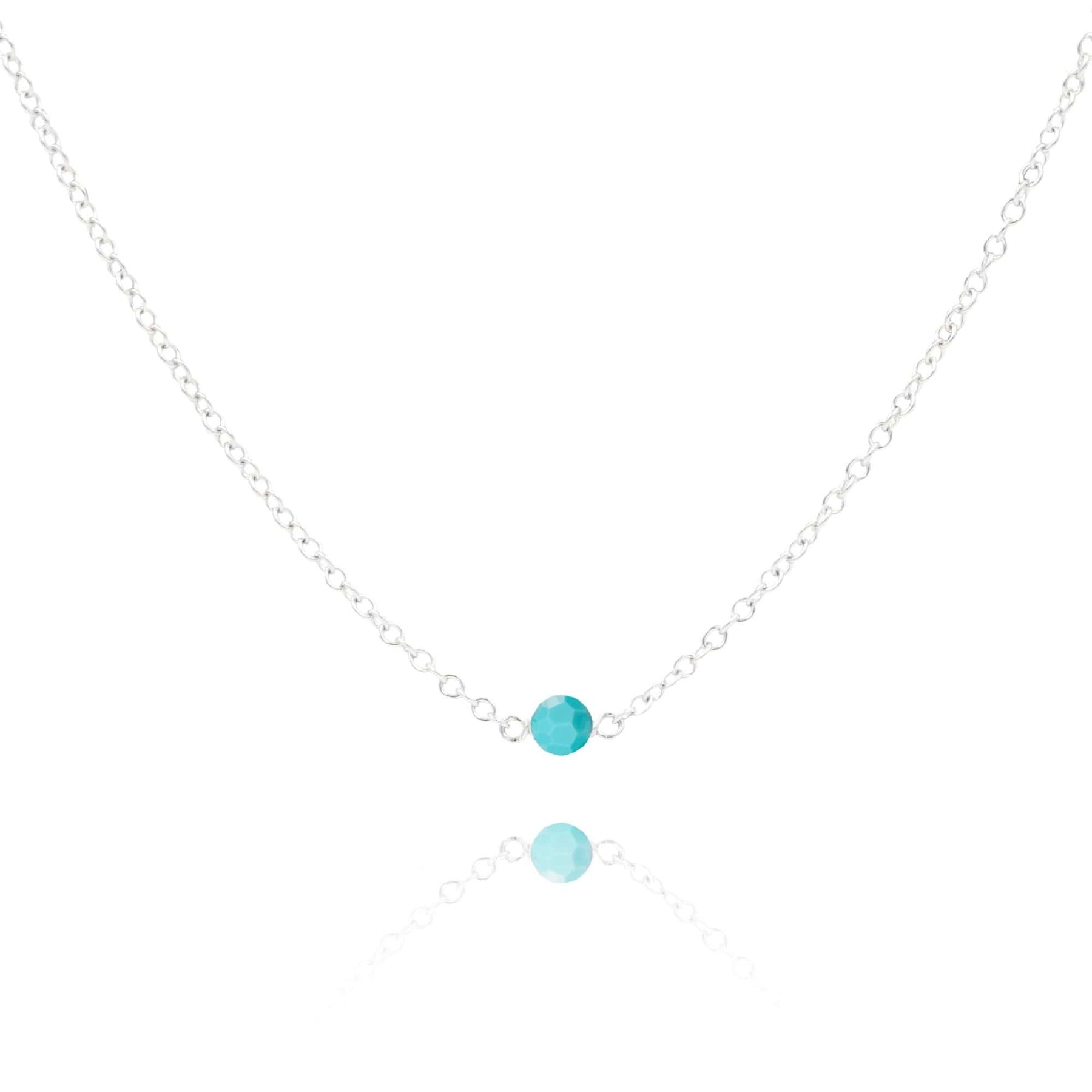 Turquoise stone sterling silver necklace on white background