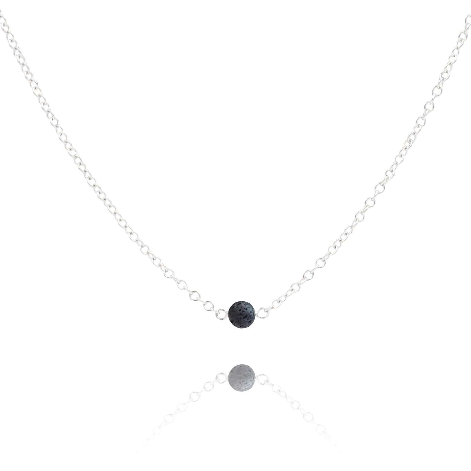 Lava stone sterling silver necklace on white background