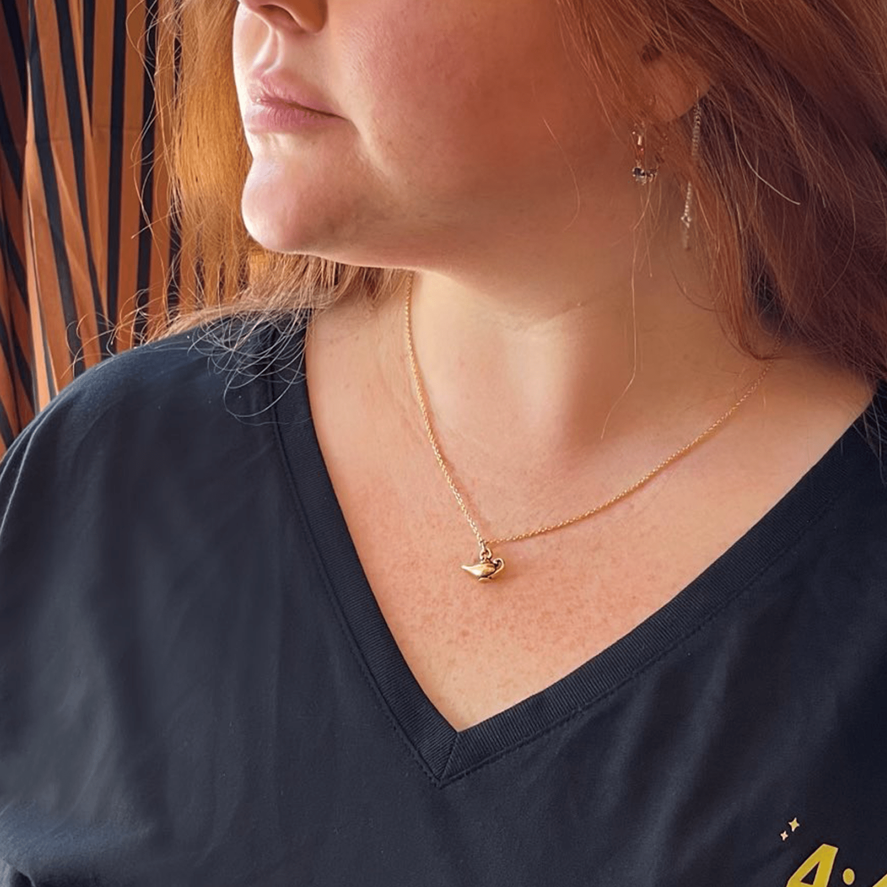 The Great gold necklace modeled on Alyse side shot